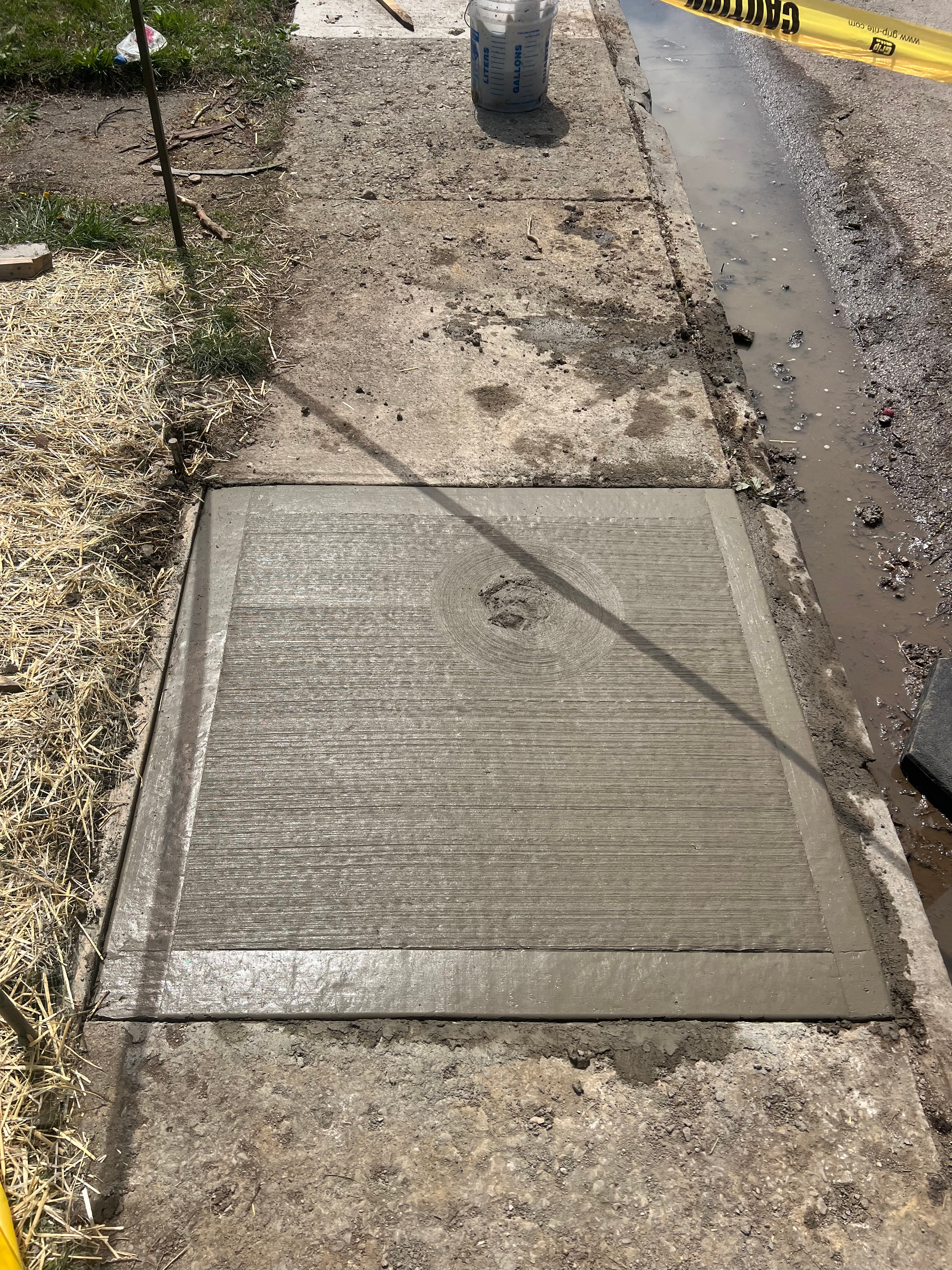 Wet concrete sidewalk