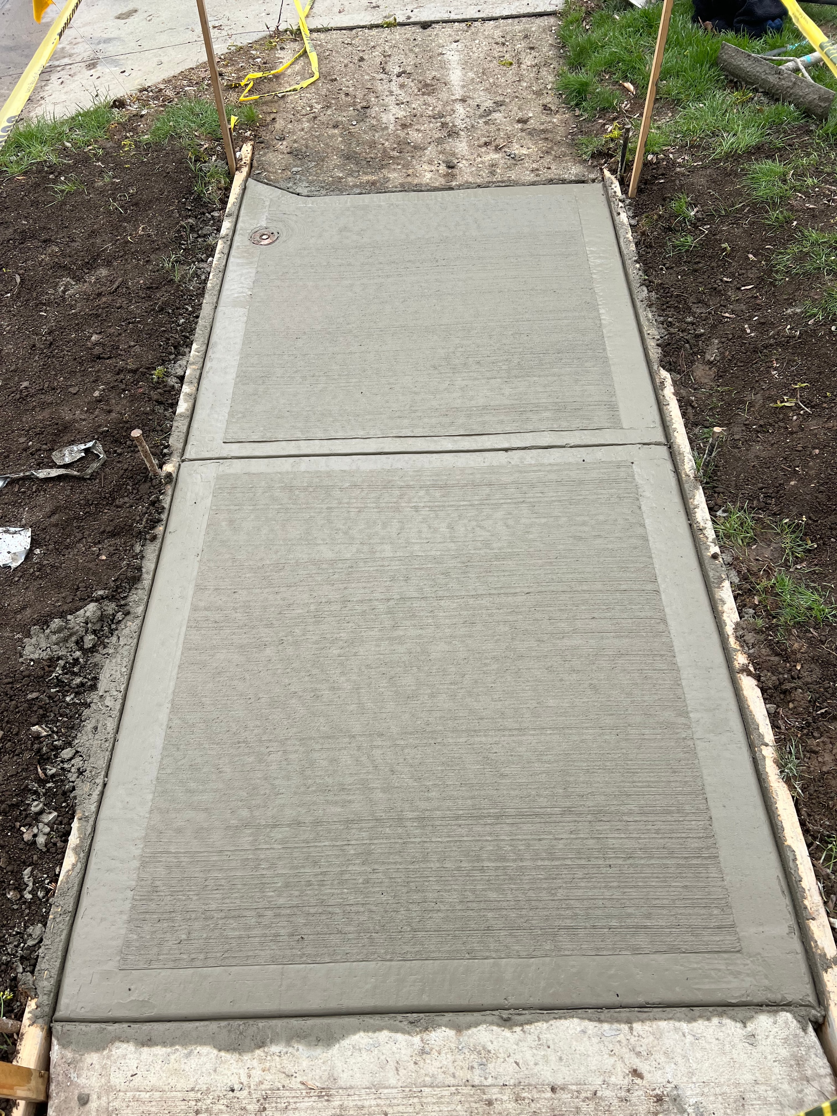 Concrete sidewalk pour with forms